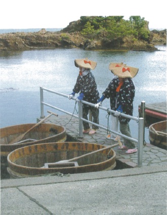 Fisherwomen and their taraibune around at harbor