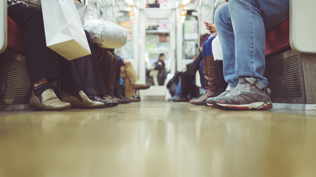 Passengers feet in subway car