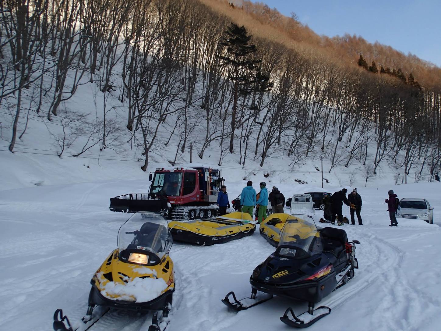 Snowmobiles and rafts. Photo by Phil Luza