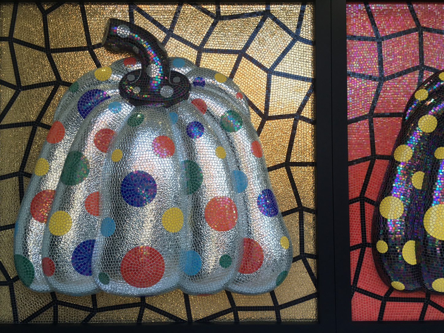 Kusama's famed pumpkin paintings and sculptures make an appearance 