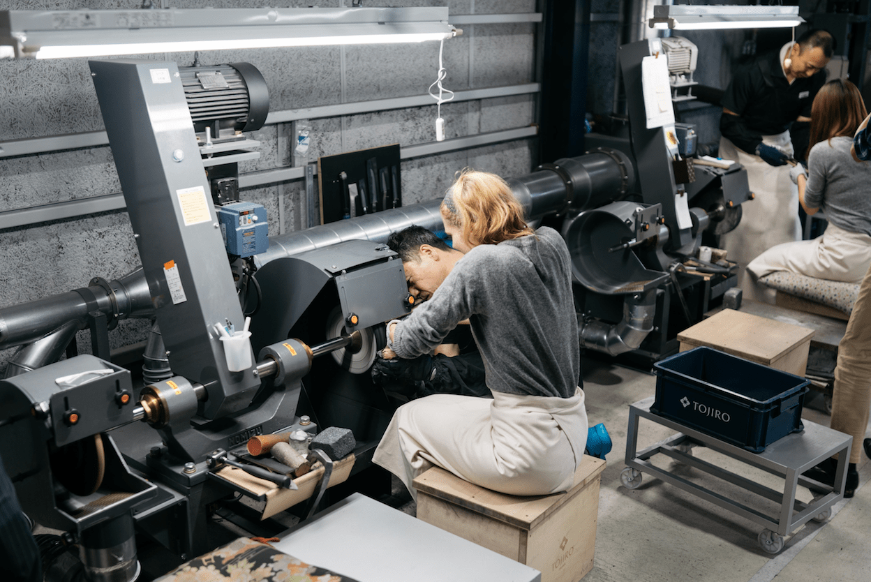 woman making knife in niigata metalworking factory