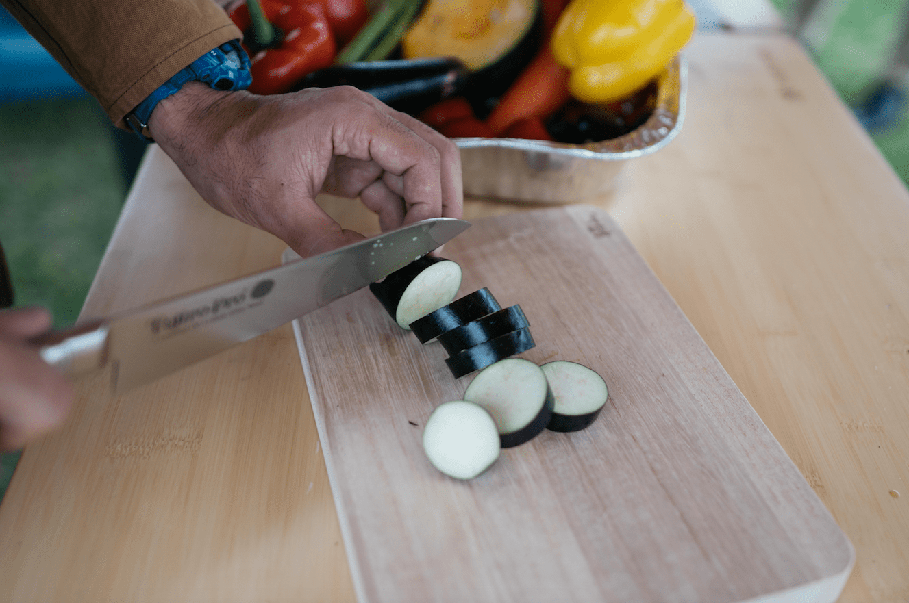 knife cutting vegetables on wooden chopping board in niigata