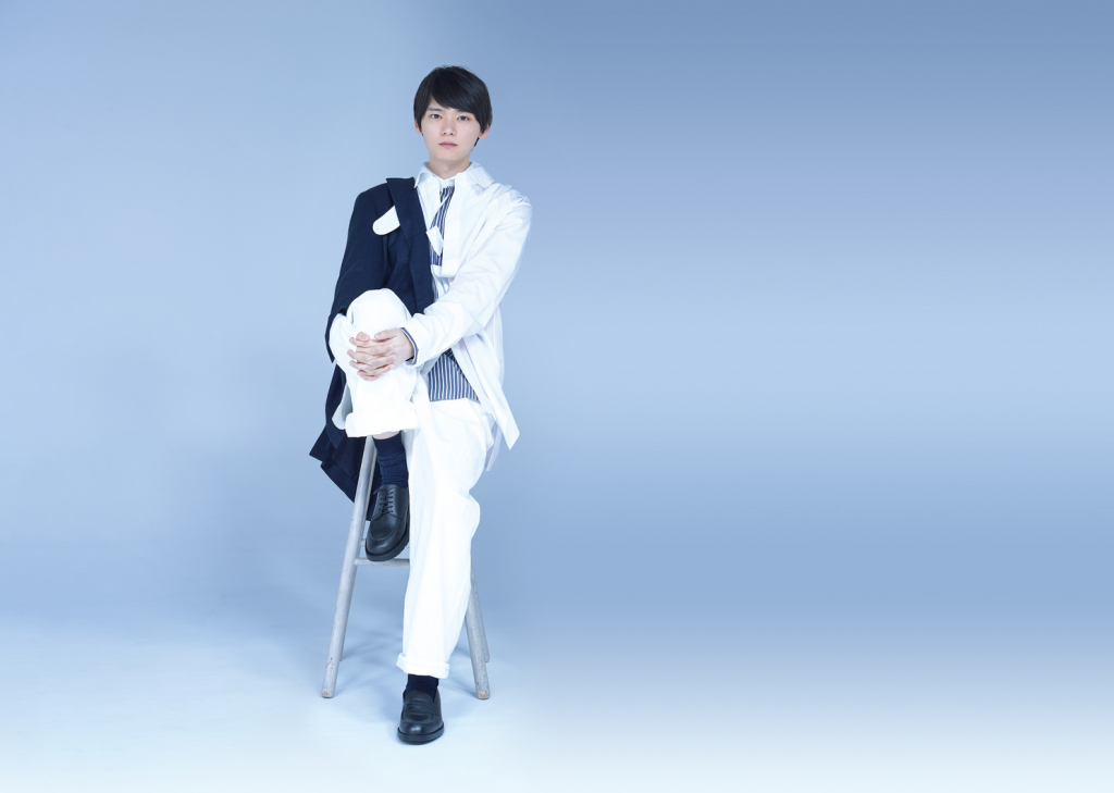 Yuki Furukawa sitting on stool